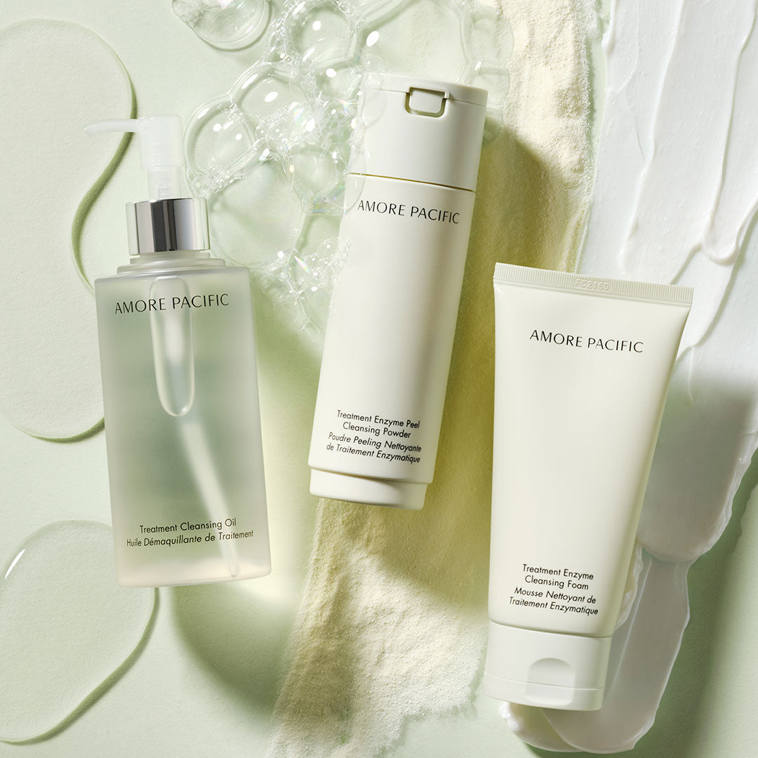 three skincare products on textured background