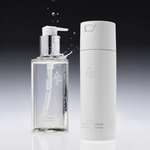 AP Beauty, Ultimate Oil To Milk Cleanser and Refining Powder-To-Foam Cleanser on grey gradient background