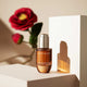 Enlarge image of Vintage Single Extract Ampoule with Camellia flower background
